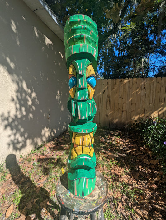 Green painted tiki.